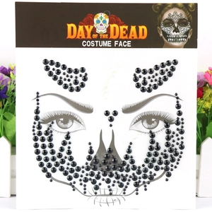 Halloween Day of the Dead face jewels with black rhinestones and sugar skull design packaging