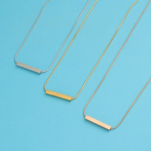 Minimalist rectangular tube pendants in silver, gold, and rose gold on sleek chains