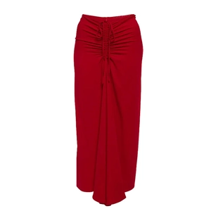 Detail of red high-waisted maxi skirt with adjustable drawstring and ruched design