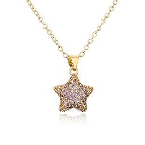 Macro detail of 18K gold-plated star pendant with pavé set purple cubic zirconia stones