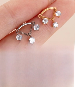 Detail of titanium cartilage stud with zircon chain showing 1.2mm gauge and 8mm length