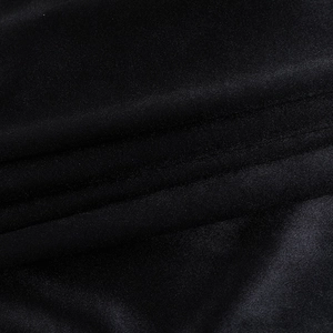 Gros plan sur la texture du tissu noir avec un éclat subtil et un tissage élastique