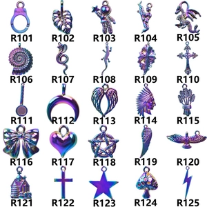 Macro view of rainbow stainless steel devil eye pendants and assorted jewelry charms