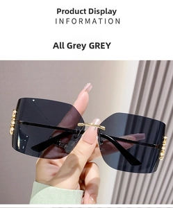 Detail view of grey rimless square sunglasses with gold metal bridge and sleek temples