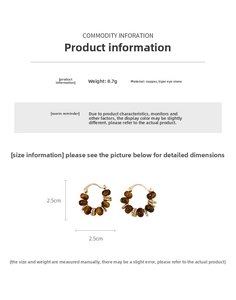 Detail view of 2.5cm retro gold-plated hoop earrings with natural tiger eye beads