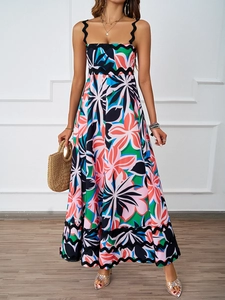 Close-up of summer floral maxi dress featuring black wave lace trim on the shoulder straps