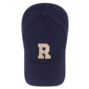 Navy blue baseball cap with gold 3D R letter embroidery seen from a top-down view