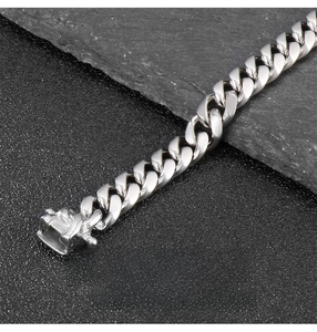 Detailed close-up of 8mm silver Cuban link chain with a secure square box clasp closure