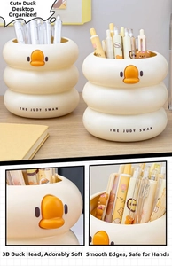 Detail of a yellow duck pen holder with three-tier stacked structure for desk storage