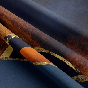 Macro detail of abstract mountain tapestry fabric with deep blue and rust red textures
