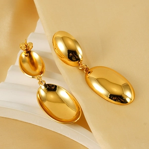 Polished 18K gold-plated oval drop earrings for women on soft champagne satin fabric