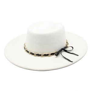 Detail of white wide-brim wool fedora with black and gold woven chain and ribbon bow