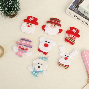 Luminous Christmas plush brooches with Santa, reindeer and snowman designs for holiday parties