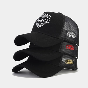 Three stacked black mesh trucker hats with New York 1985 embroidery and wing patch