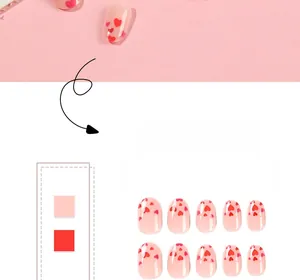 Detailed view of oval press-on nails with pink base and red heart patterns set