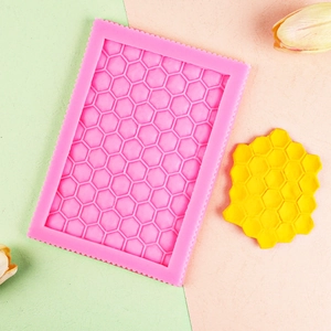 Pink honeycomb silicone mold for DIY cake lace borders and chocolate fondant decorating
