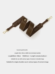 Caramel leather shoulder strap detail with gold buckle and adjustable length 89-98cm