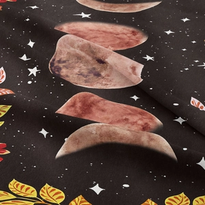 Close-up of bohemian moon phase tapestry with soft flannel texture and floral moon prints