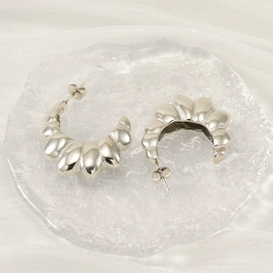 Chic silver C-shaped croissant hoop earrings with irregular wavy texture for women