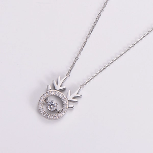 Elegant silver reindeer antler pendant necklace featuring a shimmering dancing diamond stone