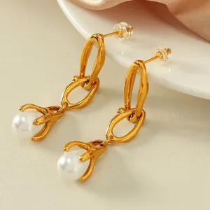 Elegant gold drop earrings with teardrop faux pearls and delicate metal chain links