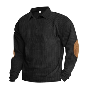 Detail view of corduroy texture and brown suede elbow patches on a black men's Polo shirt