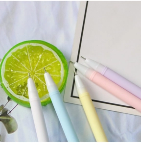 Macro shot of colorful Morandi gel pens with fine needle tips on a white fabric background