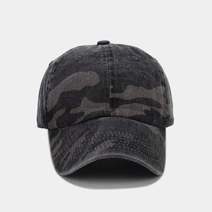 Detailed front view of a six-panel camo baseball cap with curved brim and washed texture