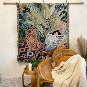 Bohemian tapestry featuring a jungle tiger scene with fringes for cozy home decor