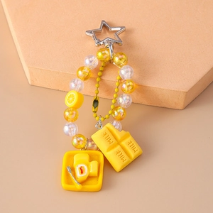 Fashion beaded keychain with lemon, milk chocolate and toast charms on star clasp
