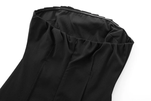 Macro detail of high-quality black fabric showing a precise invisible zipper closure