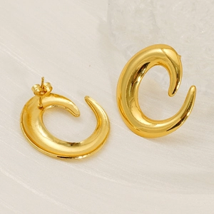 Close-up of polished gold-plated irregular C-shaped titanium steel stud earrings