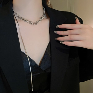 Silver leaf sequin fringe choker and layered snake chain necklace on model