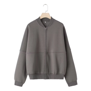Detail view of dark grey zip-up bomber hoodie with ribbed collar on wooden hanger