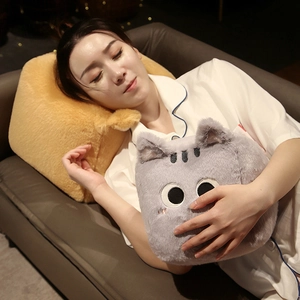 Cozy gray plush cat pillow and yellow cushion used by a model on a home sofa