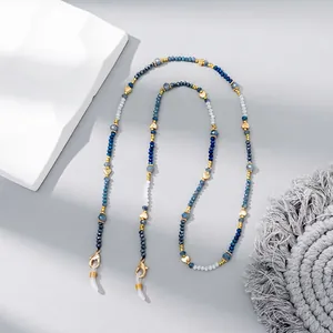 Detail of colorful crystal beaded eyewear chain with gold heart accents and lobster clasps