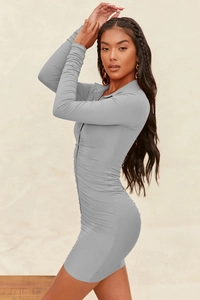 Detail of grey bodycon dress with ruching and buttons on the side view