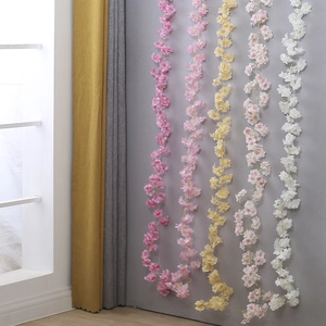 Artificial cherry blossom vines in pink, yellow and white for home and wall decoration
