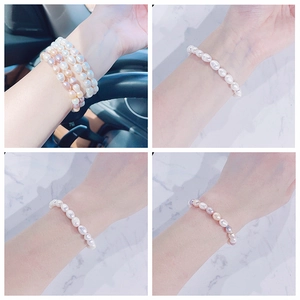 Detailed view of freshwater pearl bracelet with natural white, pink, and purple luster