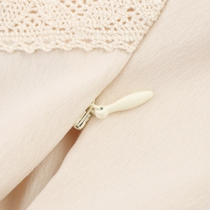Beige crop top with lace splicing detail and smooth invisible zipper close-up view