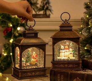 Close-up of vintage bronze Christmas lanterns with glowing Santa and Snowman inside