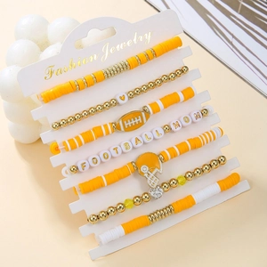 Close-up of 7-piece Football Mom bracelet set with orange Heishi beads and charms