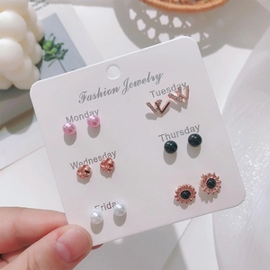 Set of six fashion heart pearl earrings on a weekday labeled card for women