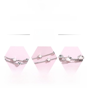 Detail view of 925 sterling silver star bracelet with polished plating and sleek box chain