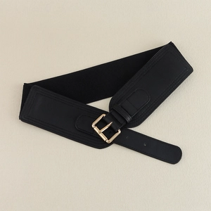 Close-up of black elastic waist belt featuring a gold square pin buckle and faux leather detail