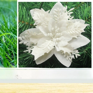 Macro detail of white glitter artificial poinsettia flower with snow texture for tree decor