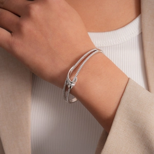 Detail view of double layer zircon bangle with elegant silver finish on female wrist