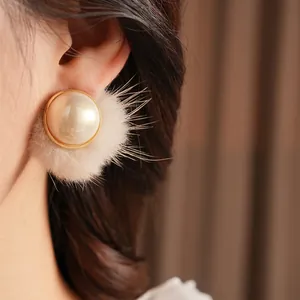 Retro pearl and plush ball drop earrings with golden metal trim for women