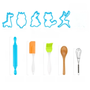 Close-up of 11-piece kids baking set with blue cookie cutters and colorful kitchen utensils