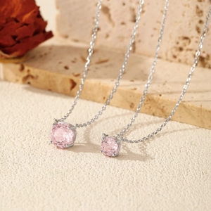 Elegant S925 sterling silver necklaces with pink square crystals on stone surface